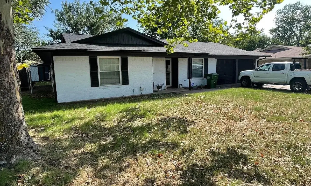 Professional roofing crew working on a residential roof in Clarksburg